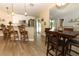 Bright and modern kitchen featuring white cabinetry, stainless steel appliances, and a breakfast bar with seating at 1512 Southwind Ct, Casselberry, FL 32707