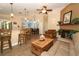 Cozy living room with a kitchen bar, comfortable seating, and wood-look tile floors at 1512 Southwind Ct, Casselberry, FL 32707