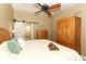 Bedroom with closet and dresser storage, neutral décor, and ceiling fan at 1512 Southwind Ct, Casselberry, FL 32707