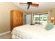 Light filled bedroom with a patio view, neutral decor and a vaulted ceiling with fan at 1512 Southwind Ct, Casselberry, FL 32707