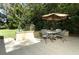 A picturesque patio area including dining seating, shed, and lawn at 1512 Southwind Ct, Casselberry, FL 32707