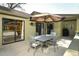 Lovely outdoor patio with dining furniture and landscaping, perfect for enjoying outdoor meals at 1512 Southwind Ct, Casselberry, FL 32707