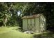 Well-placed shed among a grassy backyard and providing room for additional storage at 1512 Southwind Ct, Casselberry, FL 32707