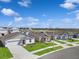 Aerial view of neighborhood homes, showing well-maintained lawns, concrete driveways and sidewalks at 1649 Teagan Ln, Winter Haven, FL 33884