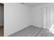 Comfortable bedroom with neutral carpet, white walls, and a closet with bi-fold doors at 1649 Teagan Ln, Winter Haven, FL 33884