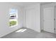 Cozy bedroom with soft neutral carpet, white walls, and a window with natural light at 1649 Teagan Ln, Winter Haven, FL 33884