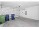 Spacious two-car garage with an automatic door opener at 1649 Teagan Ln, Winter Haven, FL 33884