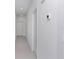 Bright hallway with tile floors, white doors, and recessed lighting for a clean and modern look at 1649 Teagan Ln, Winter Haven, FL 33884