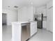 Kitchen with stainless steel appliances, white cabinets, and a center island with a sink at 1649 Teagan Ln, Winter Haven, FL 33884