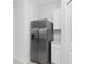 View of stainless steel refrigerator, white cabinets and quartz countertops at 1649 Teagan Ln, Winter Haven, FL 33884