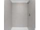 The newly tiled shower features a sleek, modern design at 1649 Teagan Ln, Winter Haven, FL 33884