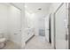 Bright bathroom with a walk-in shower, double sink vanity, and modern fixtures at 1900 Archer Dr, Minneola, FL 34715