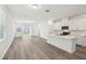 Open-concept kitchen featuring modern appliances and a central island at 1900 Archer Dr, Minneola, FL 34715