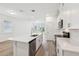 Bright kitchen featuring white cabinets, stainless steel appliances, and a view to the backyard at 1900 Archer Dr, Minneola, FL 34715