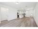 Open-concept living space with kitchen, hardwood floors, and ample natural light at 1900 Archer Dr, Minneola, FL 34715
