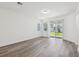 Bright, airy living room with sliding glass doors providing backyard views at 1900 Archer Dr, Minneola, FL 34715