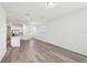 Bright living room featuring hardwood floors and white walls at 1900 Archer Dr, Minneola, FL 34715