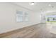 Sun-filled living room with large windows and a sliding glass door for ample natural light at 1900 Archer Dr, Minneola, FL 34715