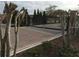 Secured community entrance with a gate at 191 Chickasaw Berry Rd, Ocoee, FL 34761