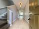 Inviting foyer features tile flooring, staircase and leads to the living area at 191 Chickasaw Berry Rd, Ocoee, FL 34761