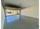 Spacious two-car garage with an open door revealing a brick paved driveway at 191 Chickasaw Berry Rd, Ocoee, FL 34761
