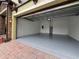 Spacious two-car garage with epoxy flooring and ample storage space at 191 Chickasaw Berry Rd, Ocoee, FL 34761