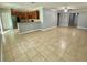 Open-concept living area with tile flooring, connecting the kitchen and living room at 191 Chickasaw Berry Rd, Ocoee, FL 34761