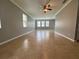 Spacious living room with tile flooring, ceiling fan, and ample natural light at 191 Chickasaw Berry Rd, Ocoee, FL 34761