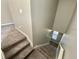 Carpeted staircase in neutral gray tones, leading to the upper level at 191 Chickasaw Berry Rd, Ocoee, FL 34761