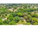 Expansive property showcasing lush greenery and mature trees, complemented by a private pool at 20 Stone Gate S, Longwood, FL 32779