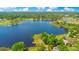 Beautiful aerial view of a lake community with lush landscapes and scattered homes at 20 Stone Gate S, Longwood, FL 32779