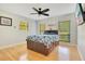Comfortable bedroom featuring a dark wooden bed frame with storage drawers and natural light at 20 Stone Gate S, Longwood, FL 32779