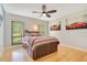 Comfortable bedroom featuring a dark wooden bed frame with storage drawers and natural light at 20 Stone Gate S, Longwood, FL 32779