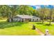 Charming single-story home with well-maintained landscaping and a long driveway, offering curb appeal and comfort at 20 Stone Gate S, Longwood, FL 32779