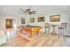 Spacious game room with a pool table, bar seating, and an abundance of natural light from the doorway entrance at 20 Stone Gate S, Longwood, FL 32779