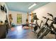 Home gym featuring weight lifting equipment, bikes, and rubber flooring at 20 Stone Gate S, Longwood, FL 32779