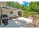 Outdoor patio with grill, storage, and a view of the backyard and pool through the sliding glass door at 20 Stone Gate S, Longwood, FL 32779