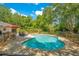 Beautiful backyard pool area with a brick patio, lounge chairs, and privacy fencing at 20 Stone Gate S, Longwood, FL 32779