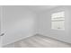 Neutral bedroom with plush carpeting, fresh paint, a window, and space ready for a new owner at 2030 Firethorn Loop, Haines City, FL 33844