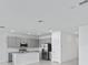Modern kitchen with stainless steel appliances, gray cabinets, and a central island for food preparation at 2030 Firethorn Loop, Haines City, FL 33844
