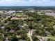 Aerial view of a neighborhood with lush greenery and various community amenities in the distance at 250 Shady Oaks Cir, Lake Mary, FL 32746