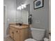 Bathroom with granite countertops and wood cabinetry at 250 Shady Oaks Cir, Lake Mary, FL 32746