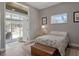 Sunlit bedroom with a pool view and hardwood floors at 250 Shady Oaks Cir, Lake Mary, FL 32746