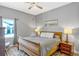 Neutral bedroom featuring a ceiling fan, patterned rug and window at 250 Shady Oaks Cir, Lake Mary, FL 32746