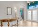 Inviting foyer with wood flooring and an elegant console table at 250 Shady Oaks Cir, Lake Mary, FL 32746