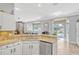 Bright kitchen featuring granite countertops, stainless steel appliances, and an open layout to other living spaces at 250 Shady Oaks Cir, Lake Mary, FL 32746