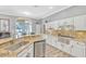 Well-appointed kitchen with granite countertops, stainless steel appliances, and views to an outdoor entertainment area at 250 Shady Oaks Cir, Lake Mary, FL 32746