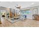 Living room with fireplace, wood floors, clerestory window, and gray walls at 250 Shady Oaks Cir, Lake Mary, FL 32746