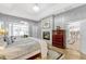 Main bedroom with fireplace, hardwood floors, and open doorway to kitchen at 250 Shady Oaks Cir, Lake Mary, FL 32746