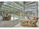 Enclosed patio with a beautiful pool, dining set and chaise lounge at 250 Shady Oaks Cir, Lake Mary, FL 32746